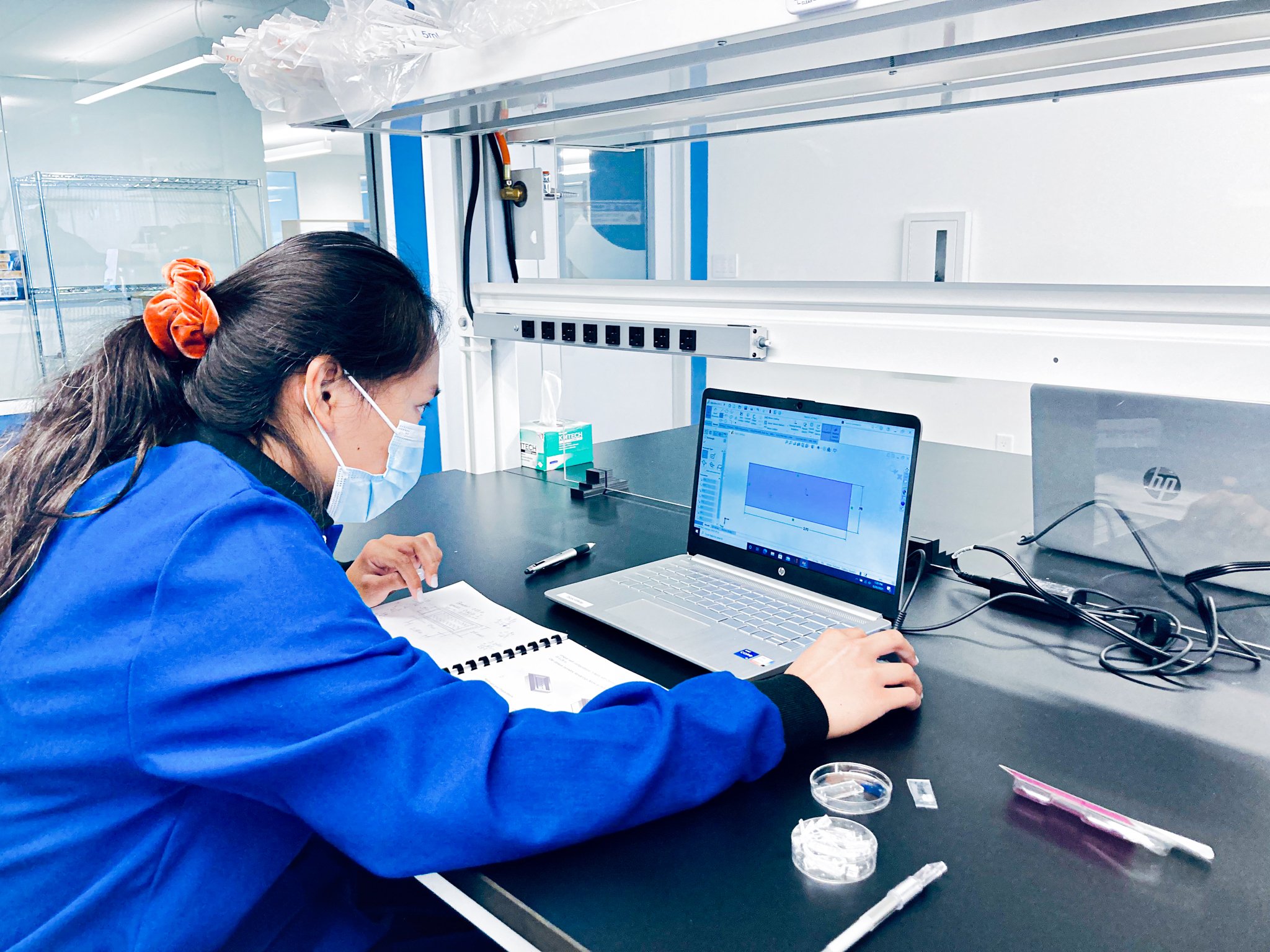 researchers analyzing complex systems in a modern lab