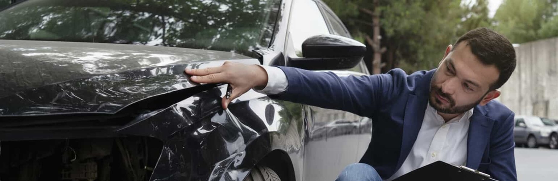 A visual representation of assessing vehicle damage for insurance claims.