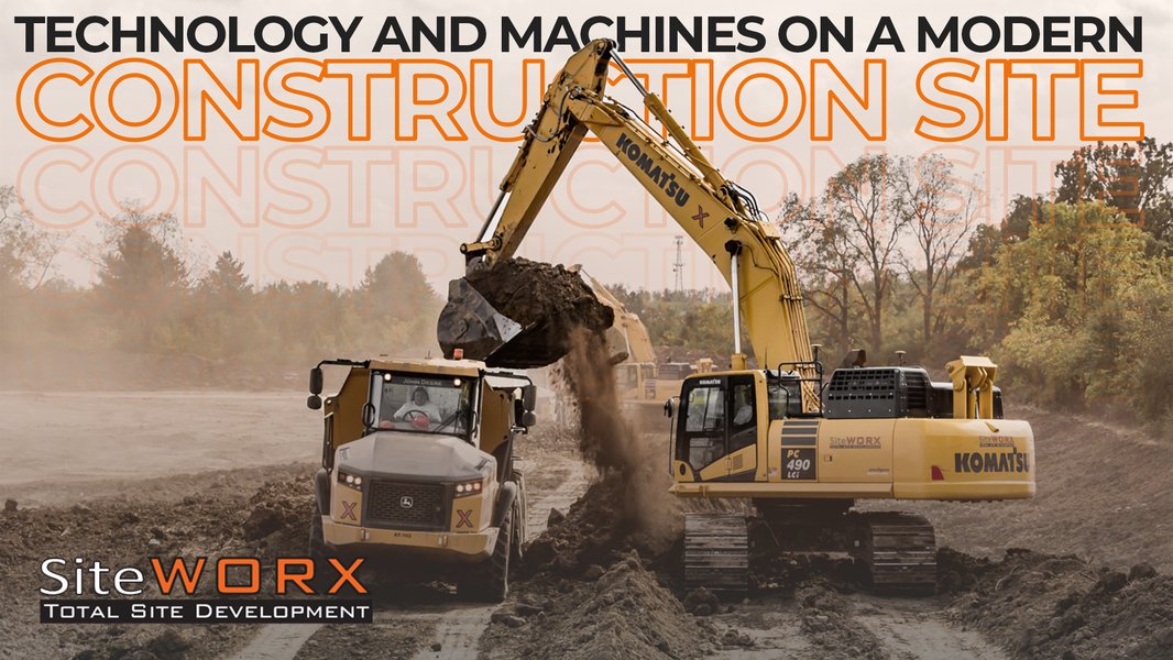 Modern construction site showing various types of heavy machinery and technology integration