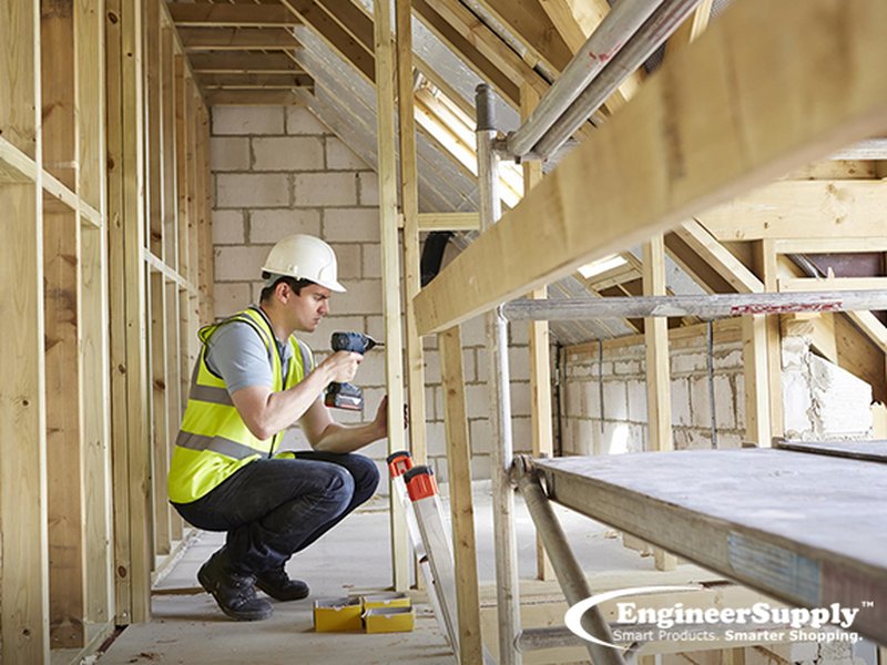 Construction worker using a tablet on a job site