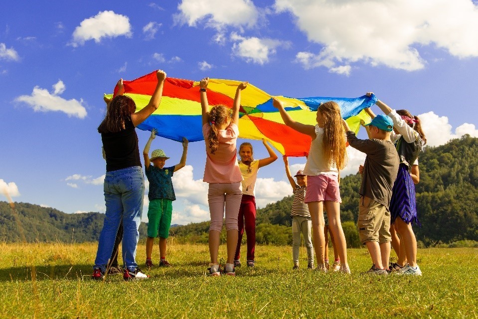 landscape with groups engaging in fun activities