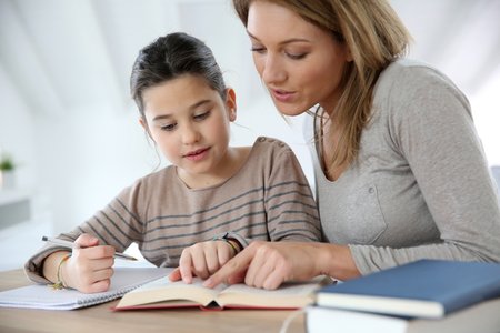 parents helping children study at home
