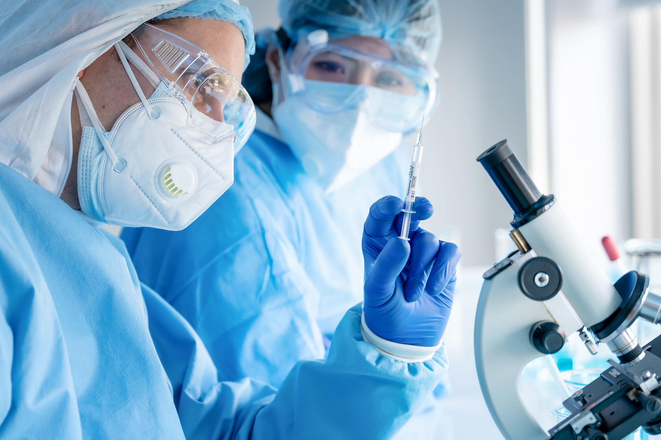 scientific laboratory and legal documents on mRNA vaccines