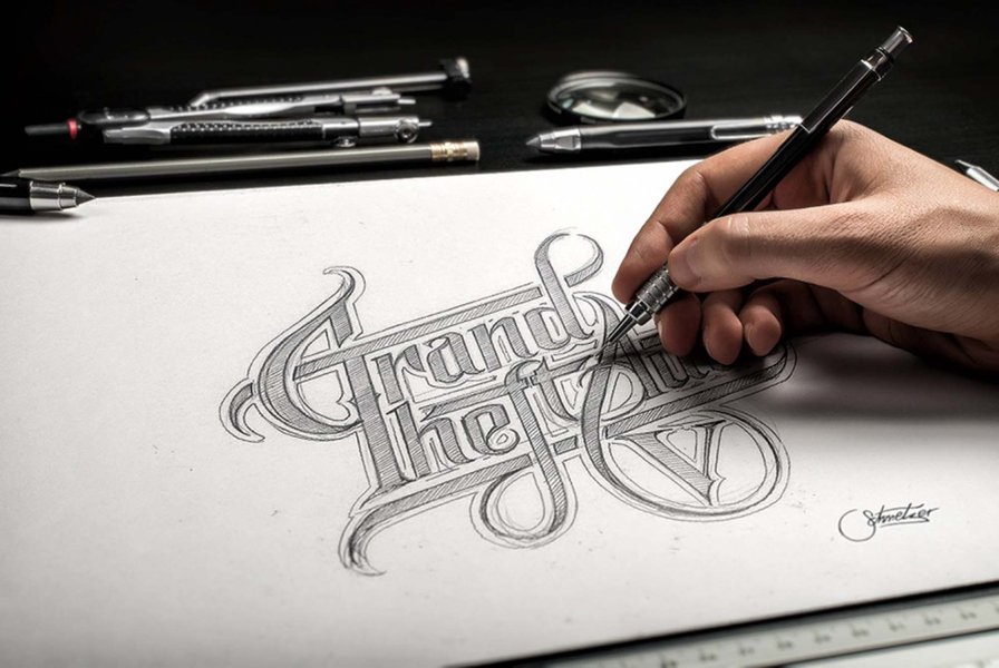 Hand-drawn logo sketches on paper