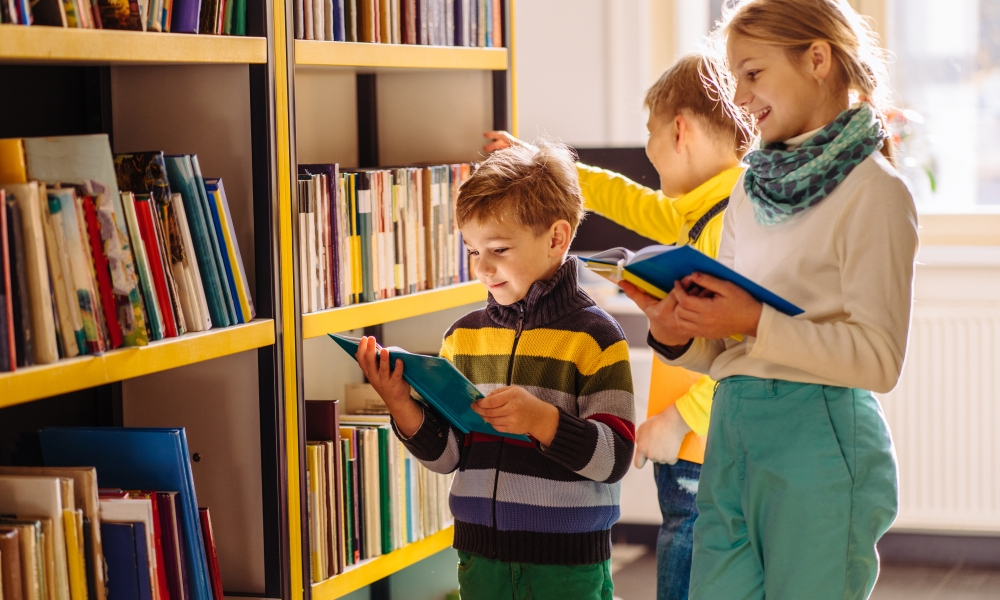 students studying books in a library