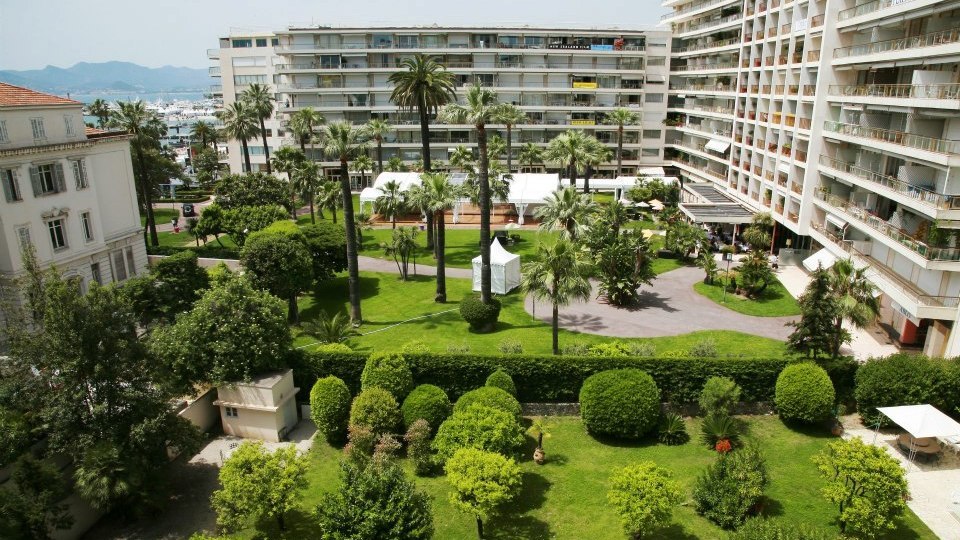 JW Marriott hotel building exterior and green gardens