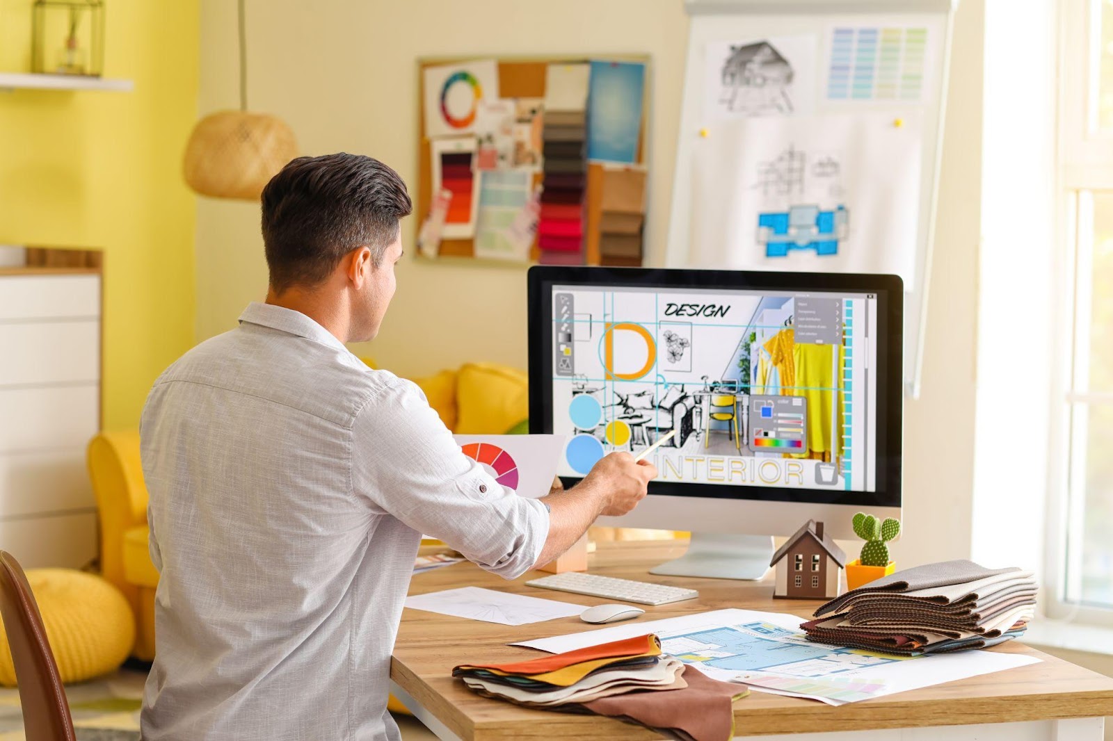 physical scenery of computer workspace with code and designers