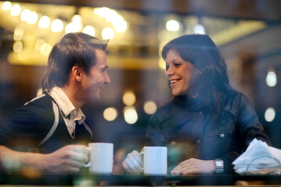 couple discussing relationship at coffee shop