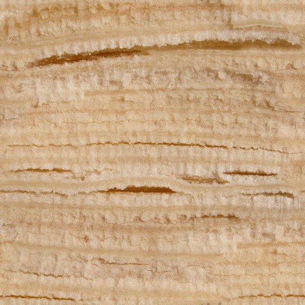 Texture of a banana peel showing its smooth surface with some brown spots