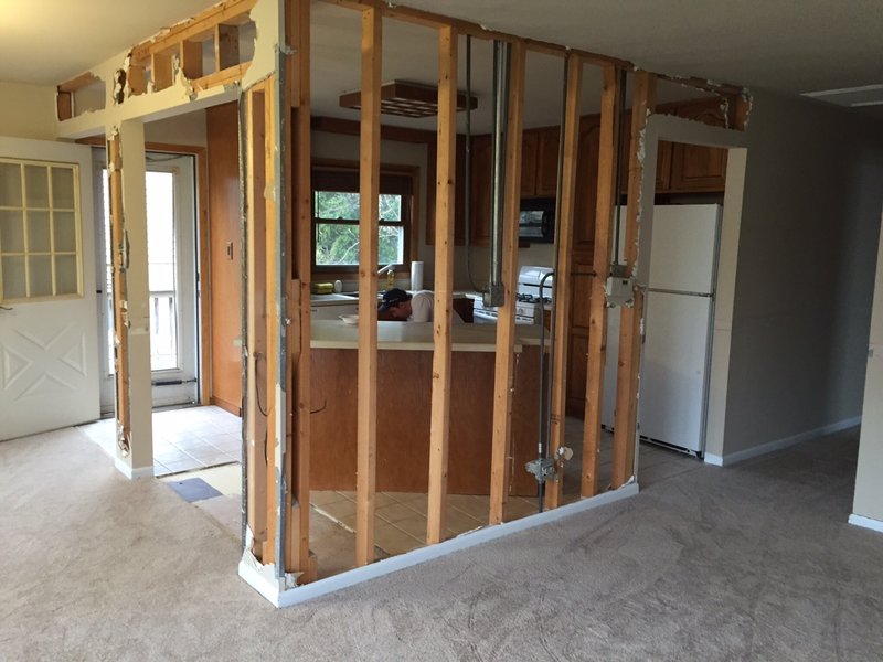 A bright, open-plan kitchen and dining area after wall removal.