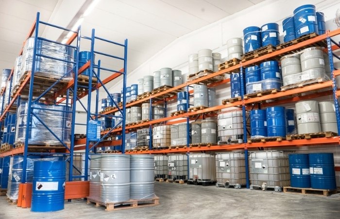 industrial chemical containers on a storage shelf