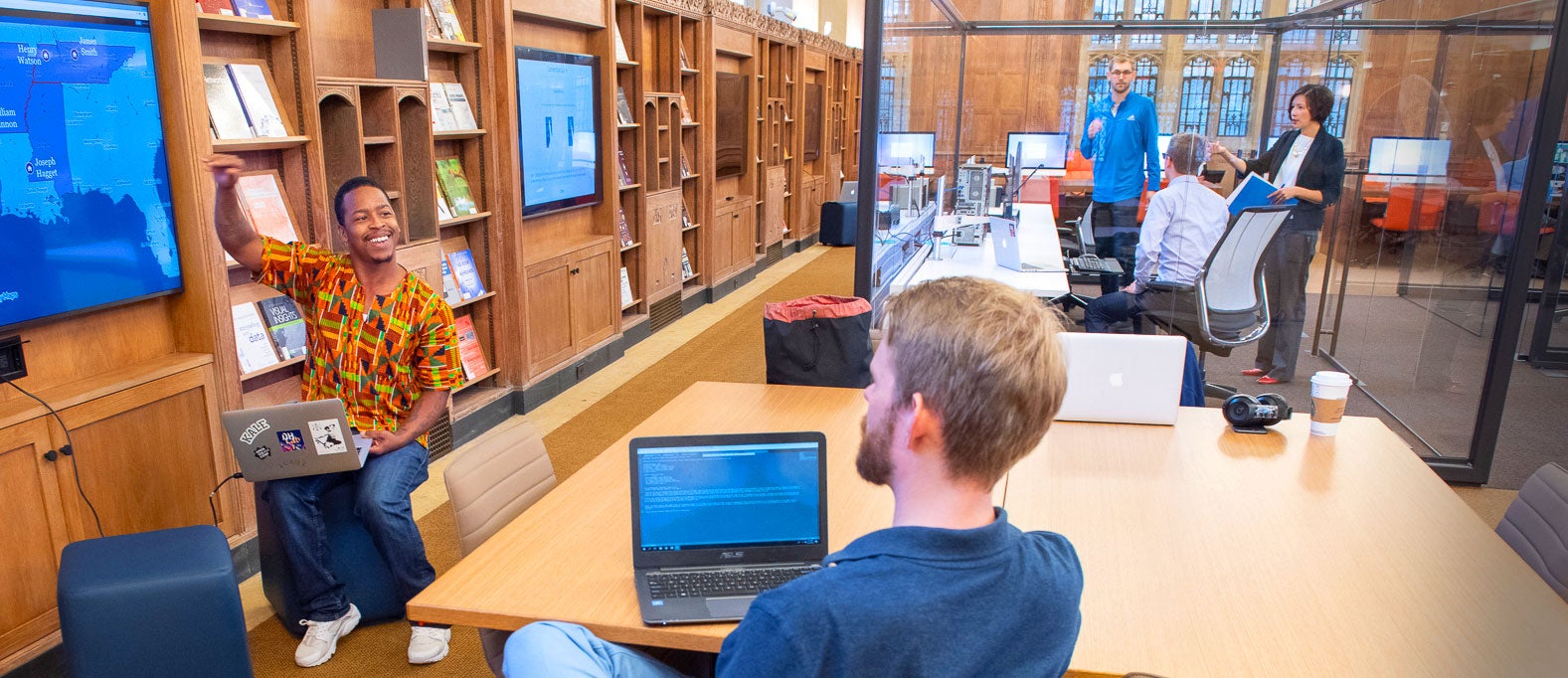 modern digital library with people using devices