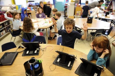 study desk, digital devices, classroom setting