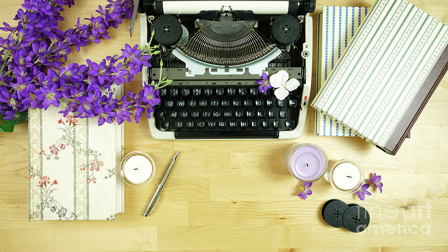 vintage typewriter on desk with books