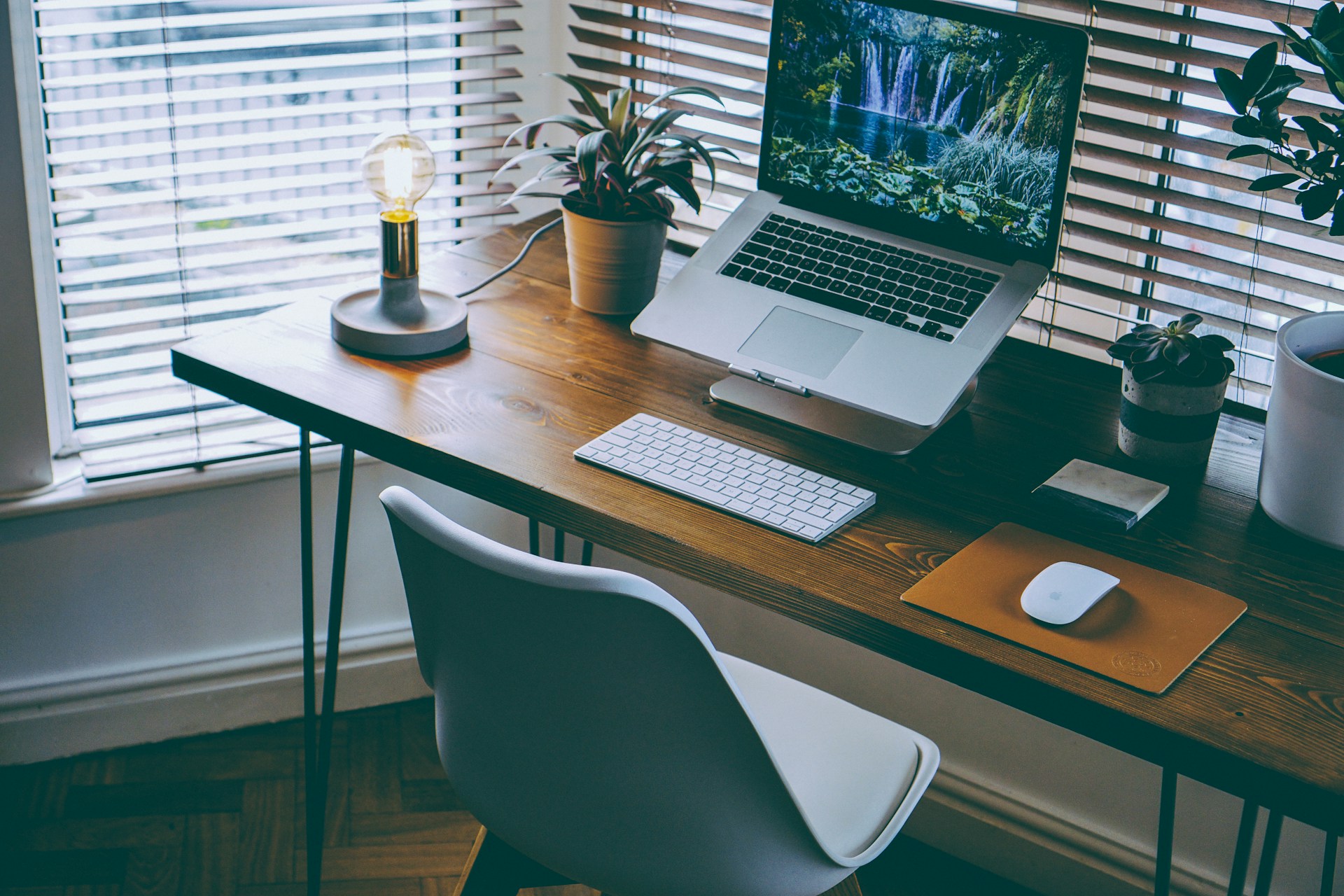 office desk with documents and laptop