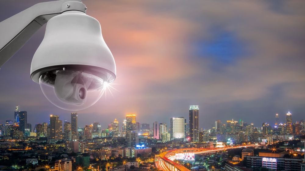 urban skyline, surveillance cameras, modern cityscape