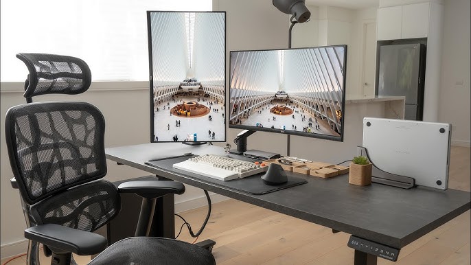 modern computer desk with multiple monitors
