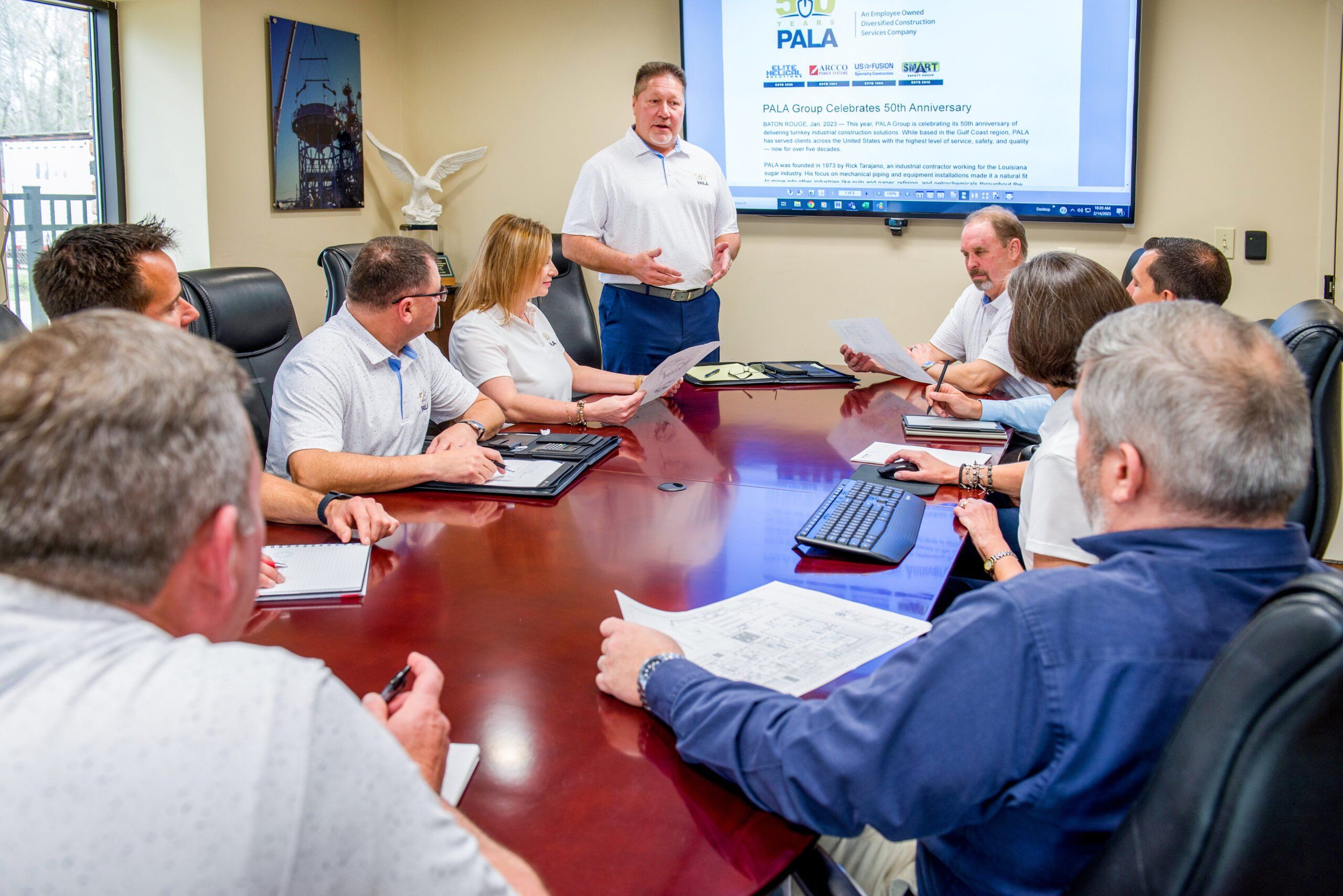 industrial equipment and diverse team meeting