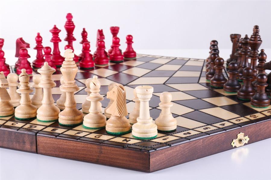 chess board with pieces and players