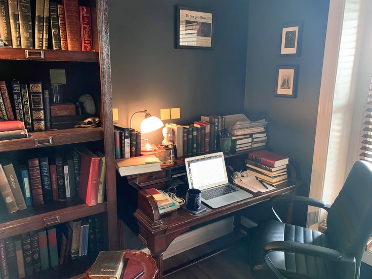 academic desk with books and laptop