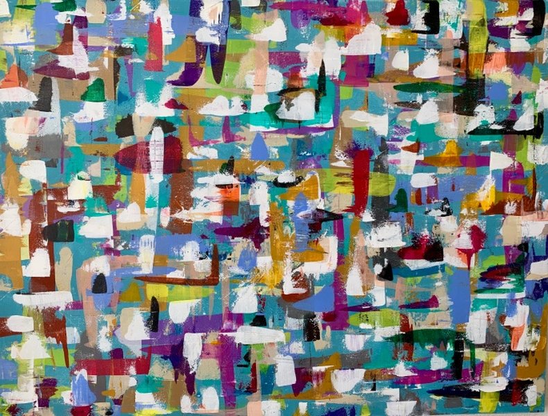 Hands painting colors on a canvas