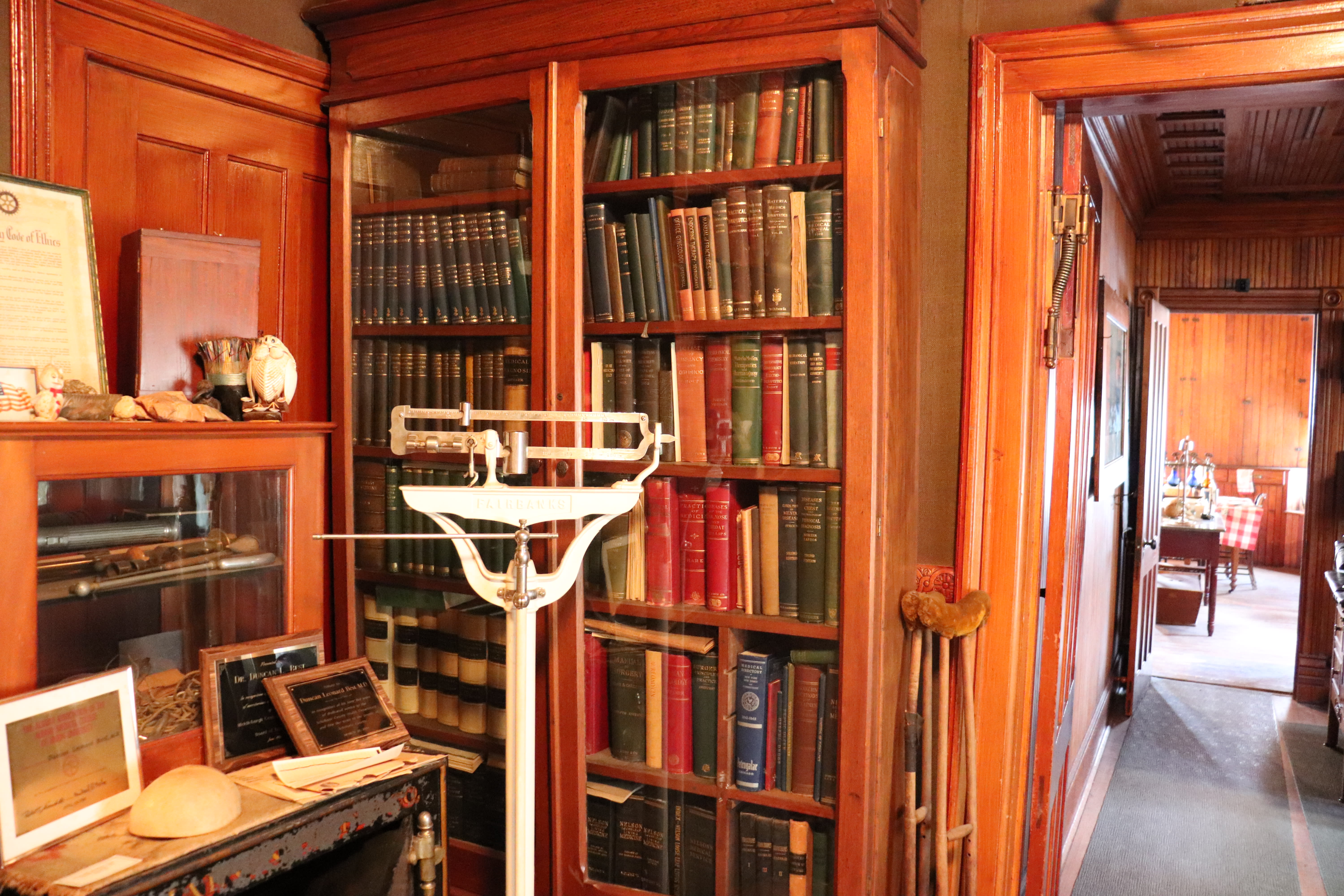 scenic photo of bookcase and ethics documents