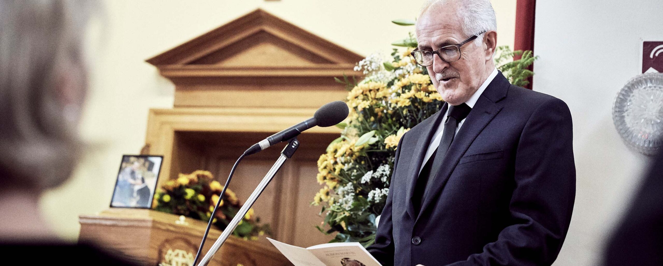 funeral tribute speech microphone