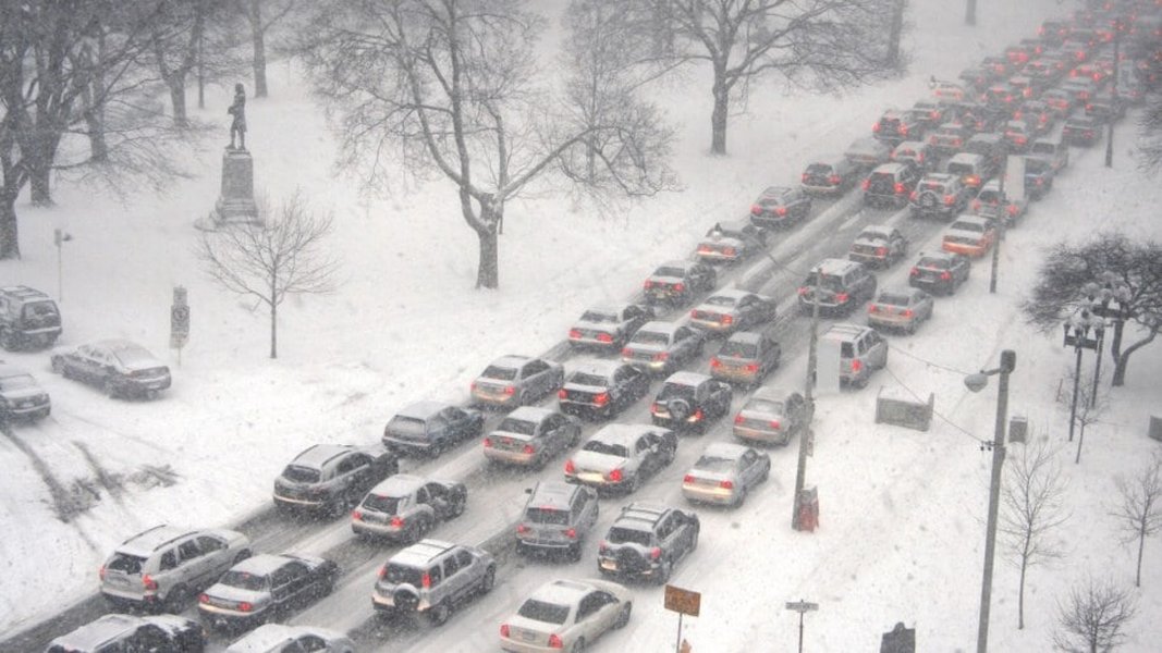 Cars stuck in snow traffic jam on highway