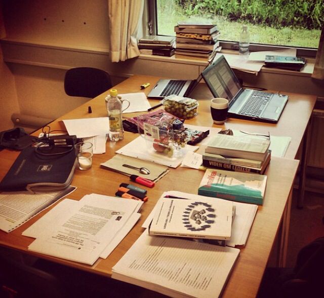 study desk with books and laptop