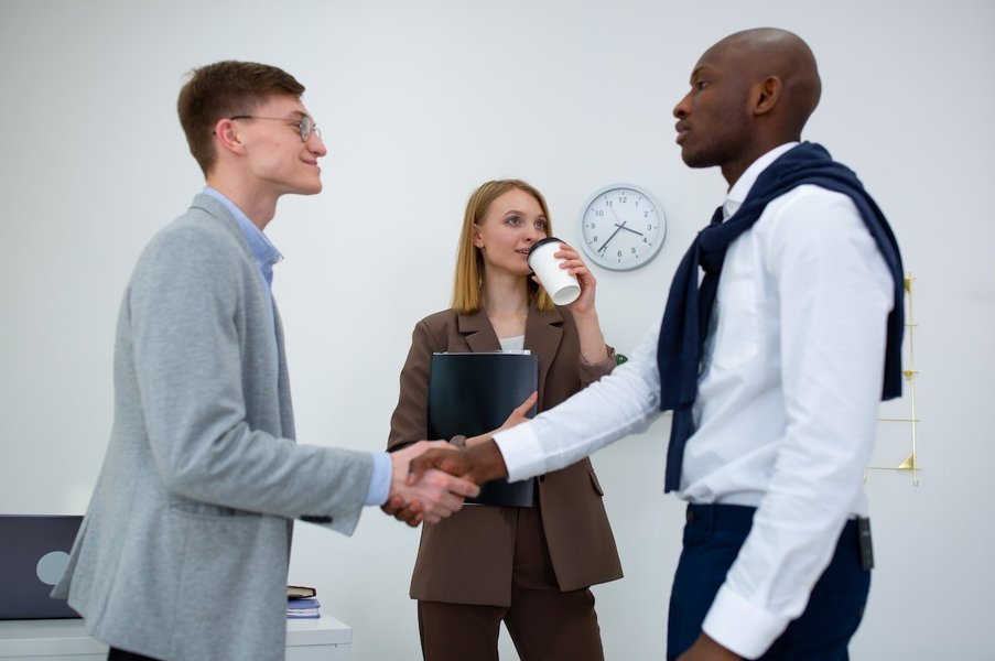 Man shaking hands with an interviewer