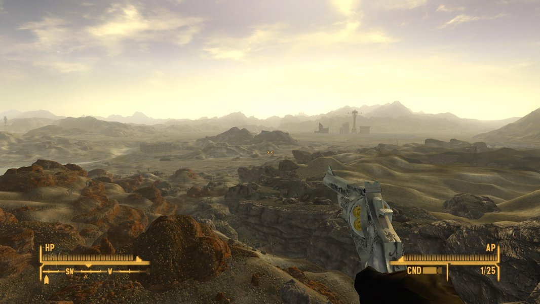 A character in Fallout: New Vegas overlooking a desolate wasteland scene.