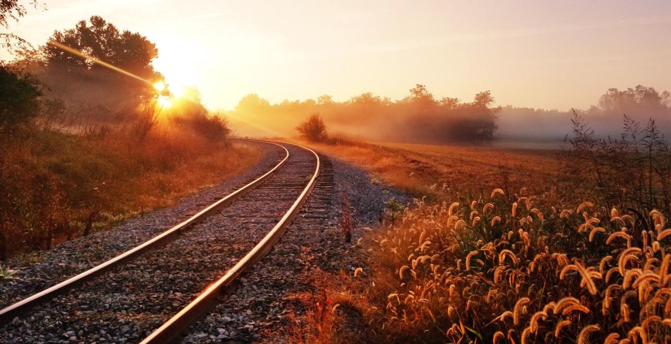 train tracks with scenic landscape