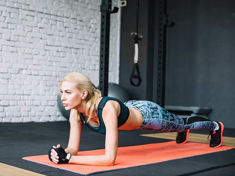 Women doing weight training with dumbbells.