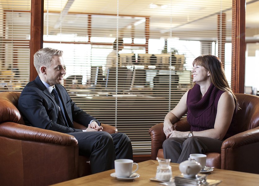 Financial advisor speaking with a client