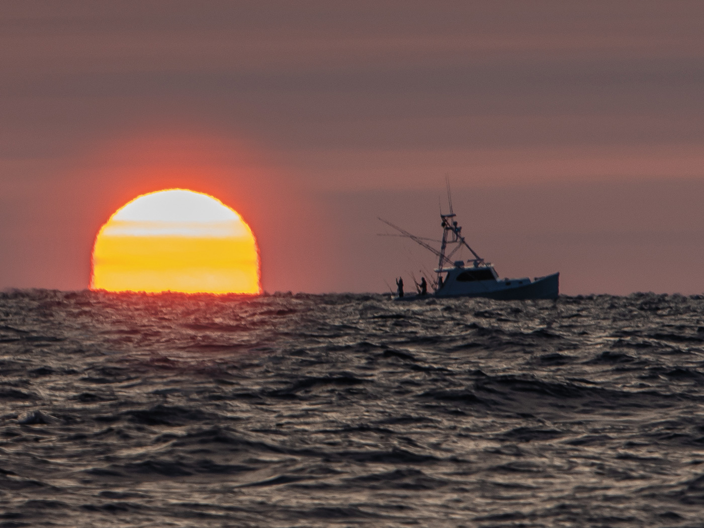 fishing boats ocean sunset