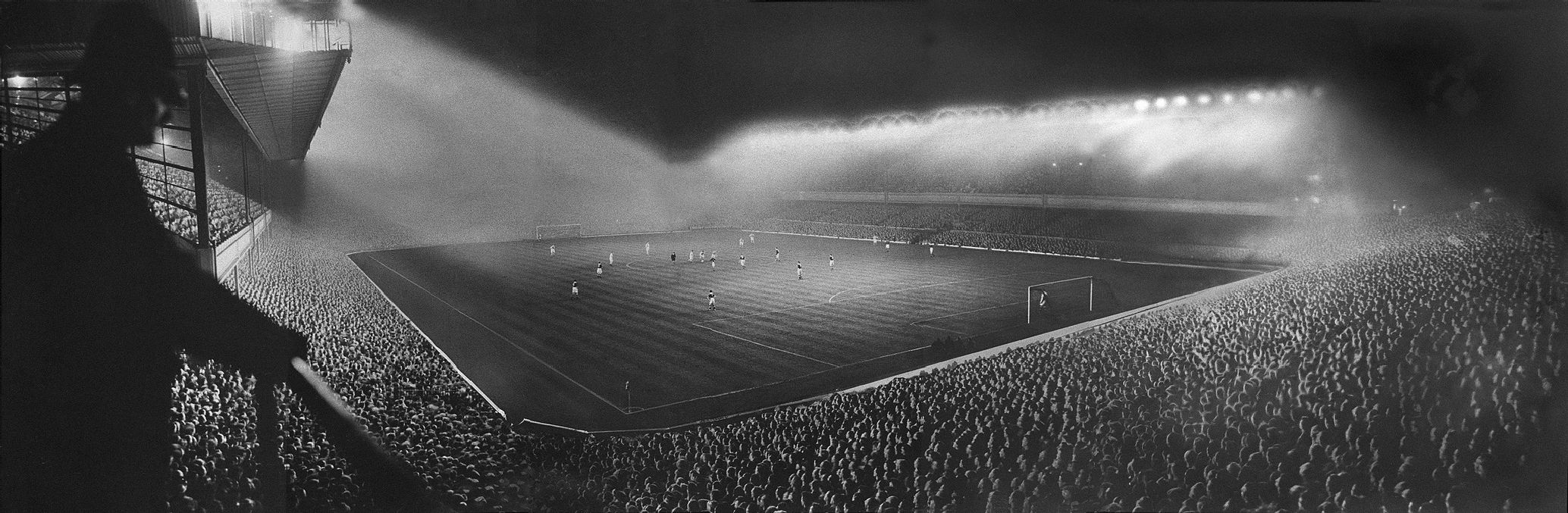 football stadium under floodlights