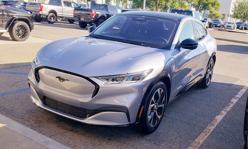 Ford Service Center with technicians working on vehicles.