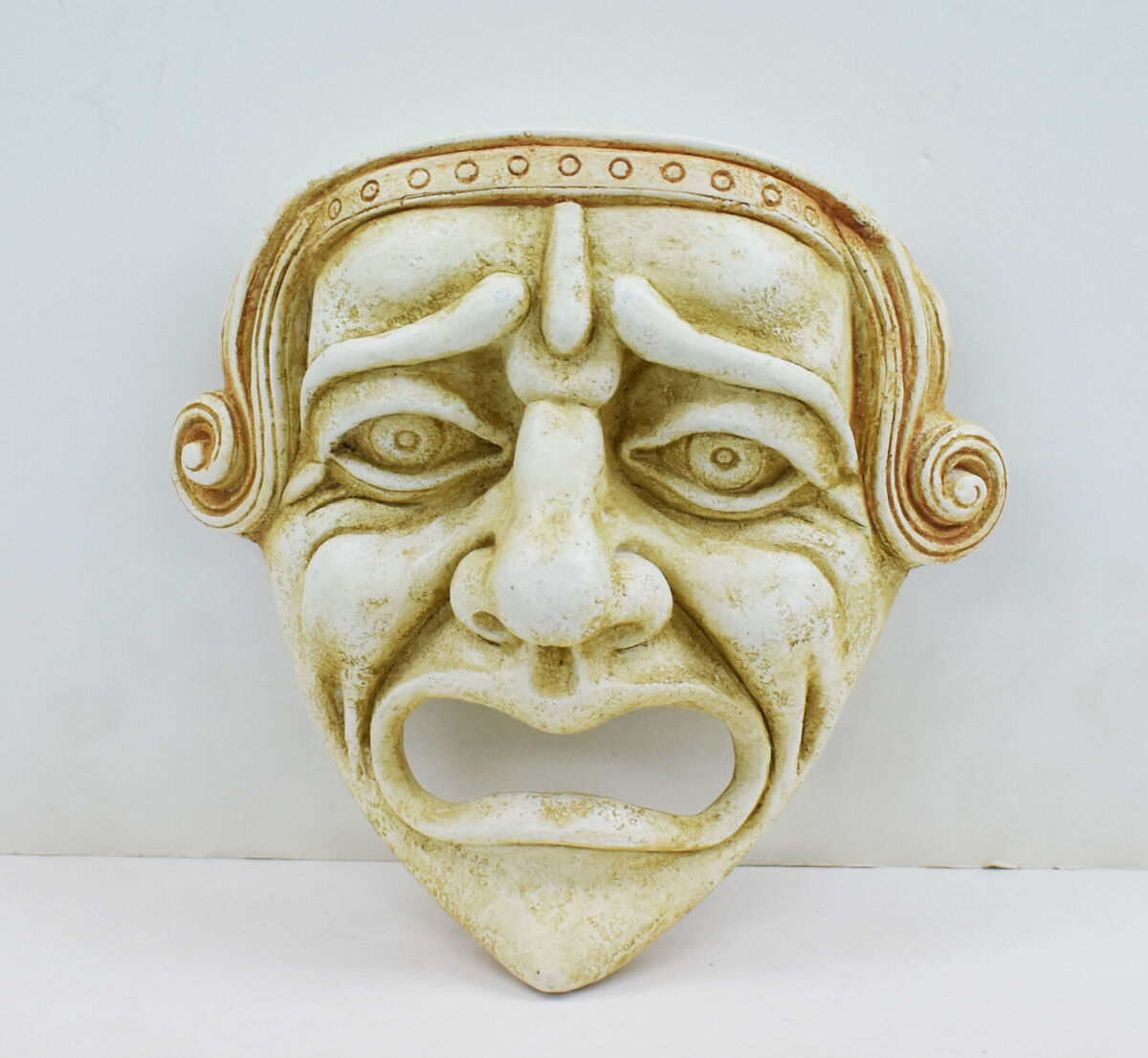 old books and ancient theater masks