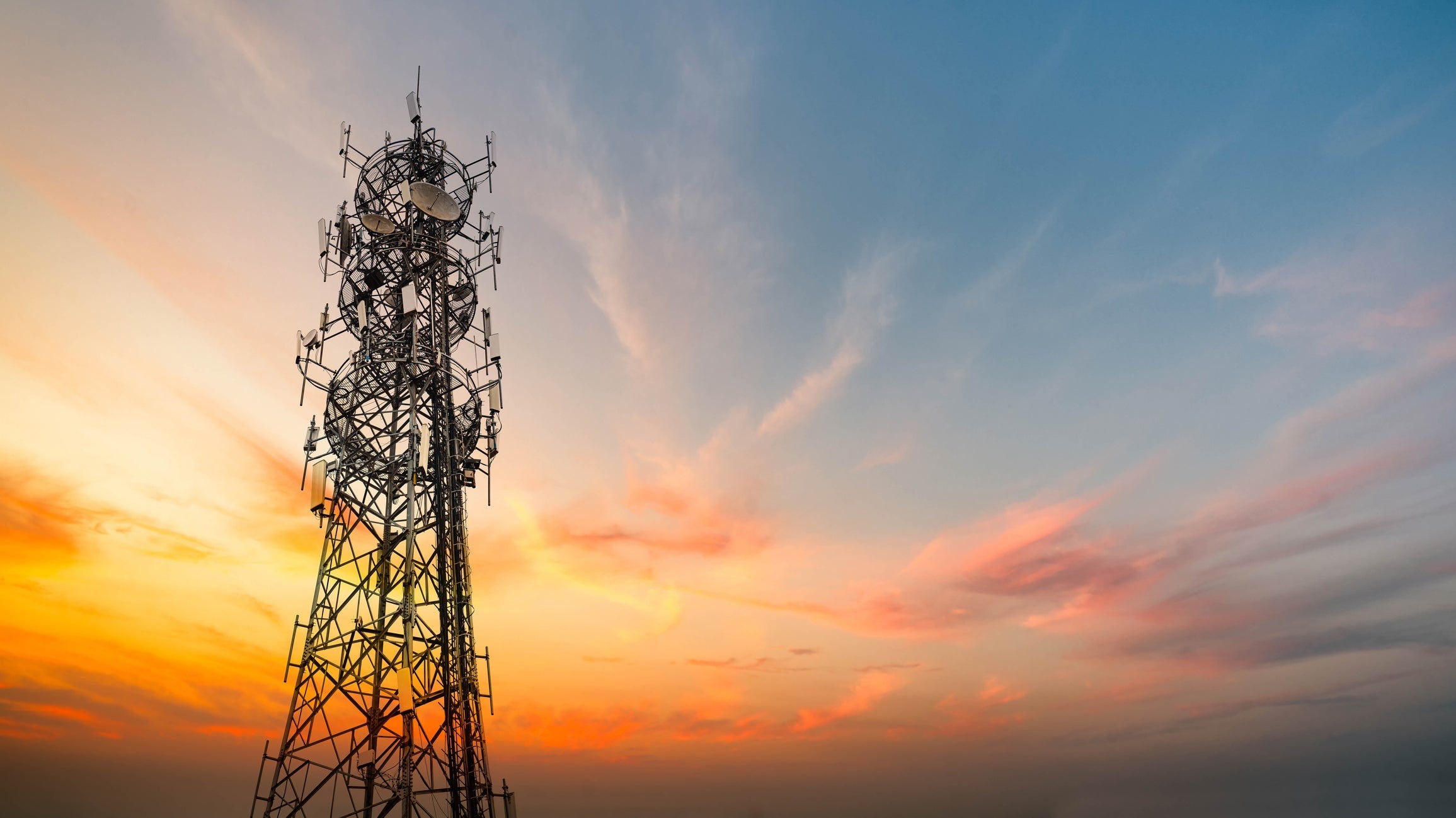 telecom towers in sunset