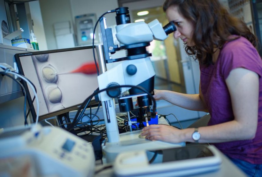 Scientist working with CRISPR materials in a lab