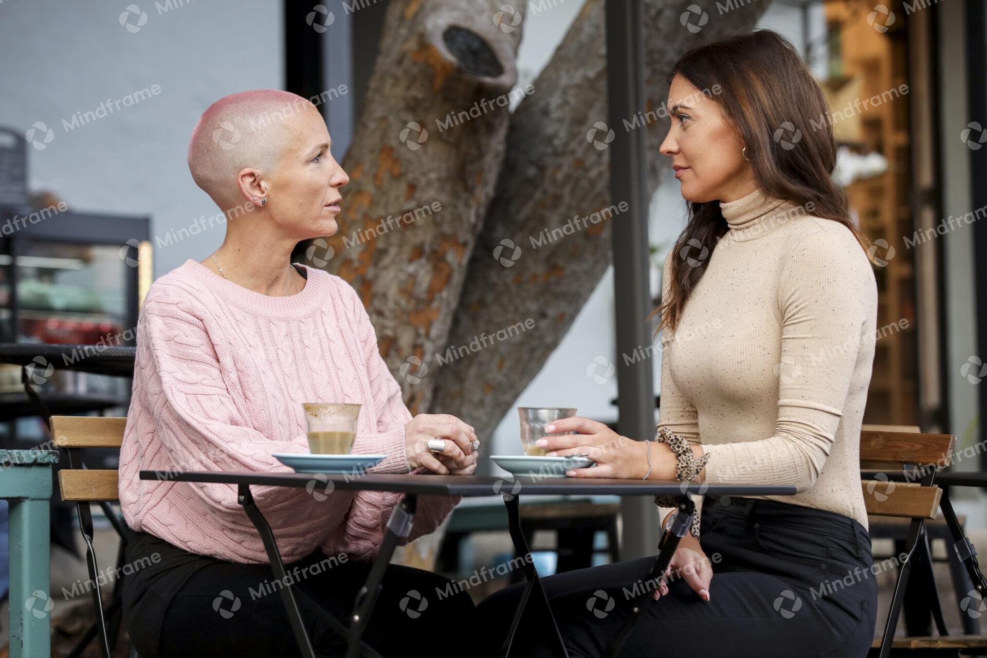 people talking at a cafe