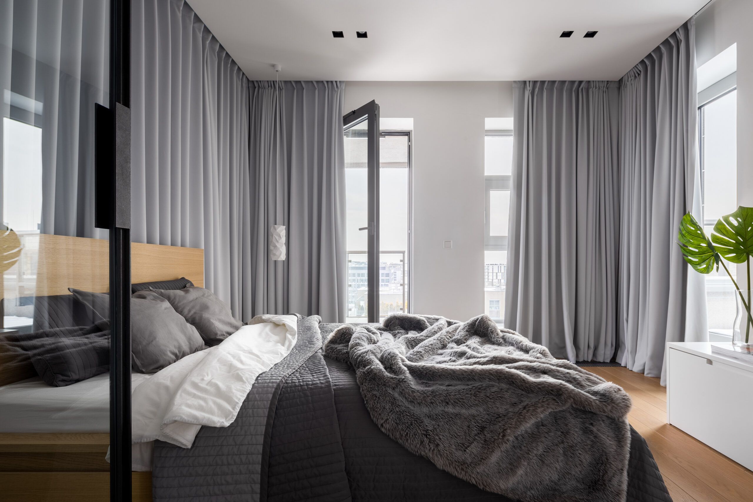 bedroom with blackout curtains and comfortable bedding