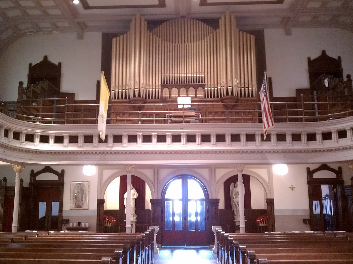 historic church facade with choir performance