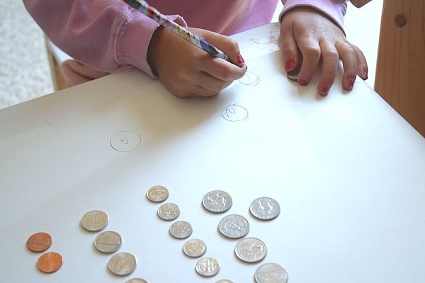 children learning math with coins