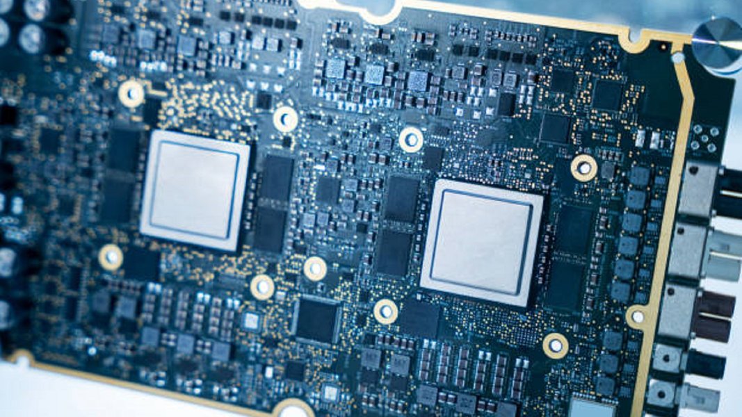A detailed view of a Printed Circuit Board (PCB) for a graphics card, showing various traces and component pads.