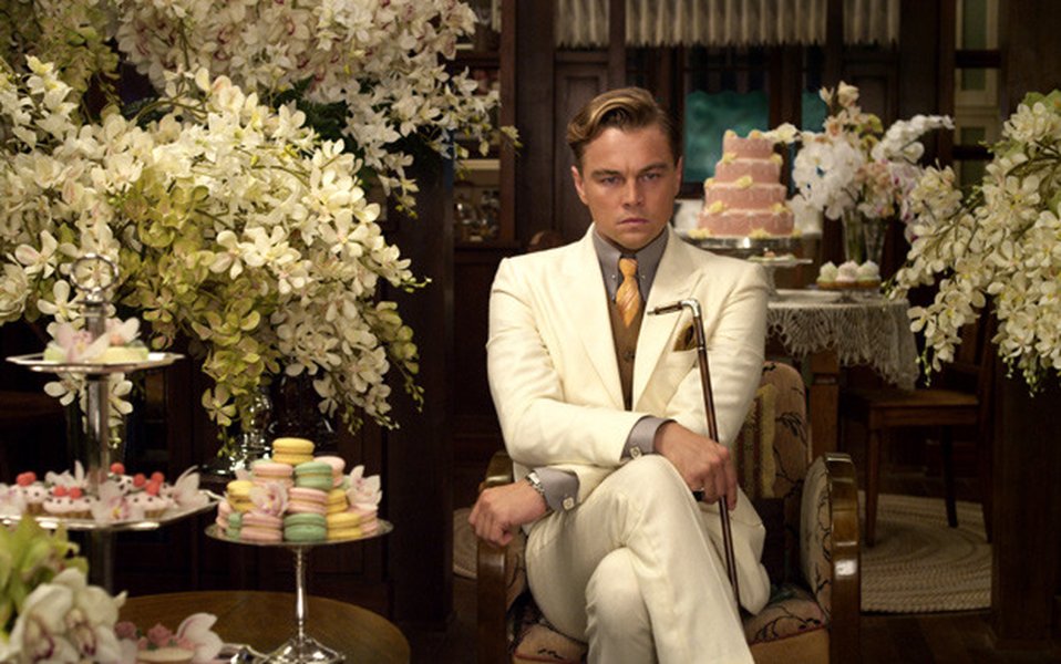 Leonardo DiCaprio as Gatsby looking intensely towards Carey Mulligan as Daisy