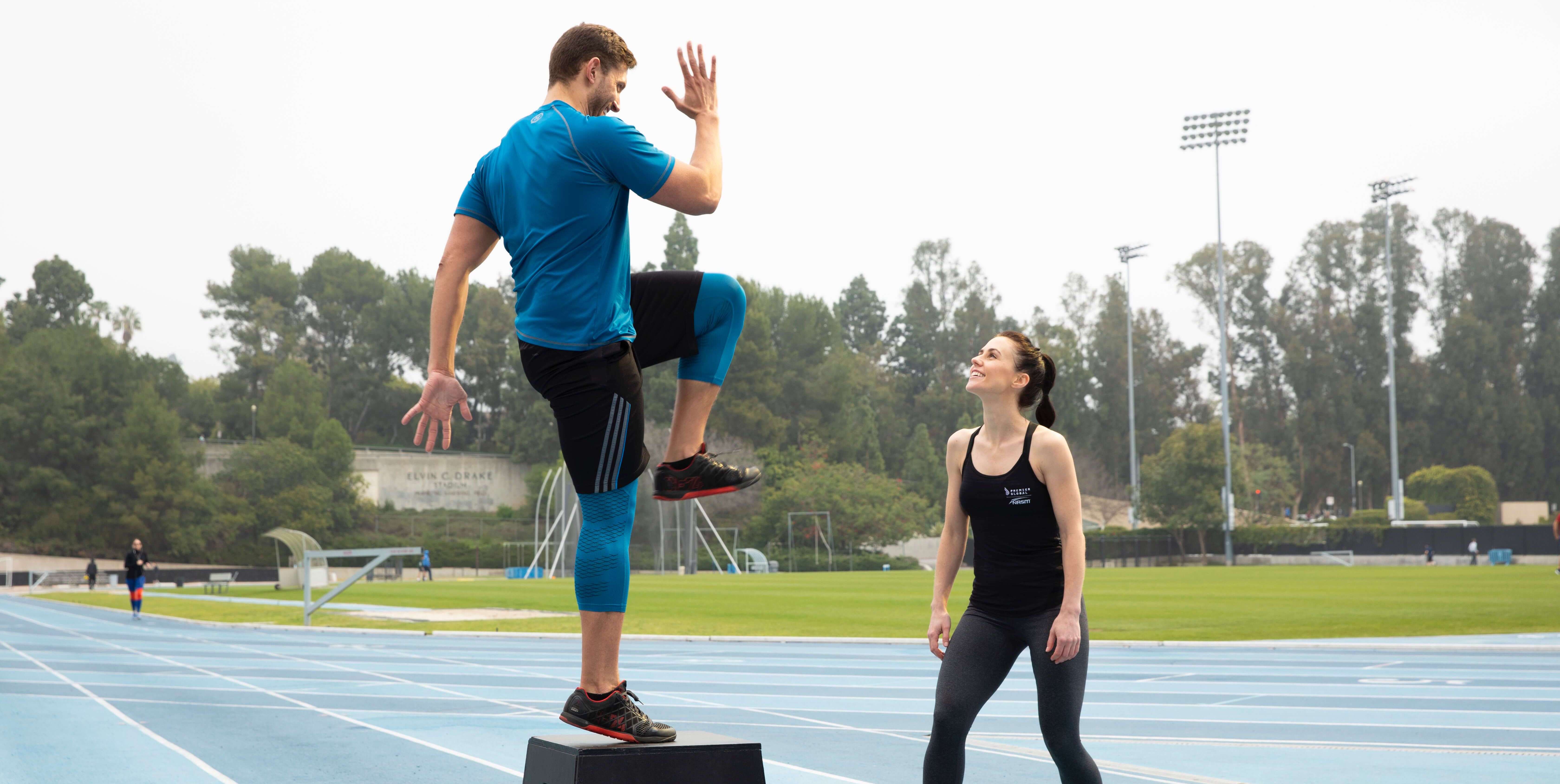 athletes training outdoor sports field