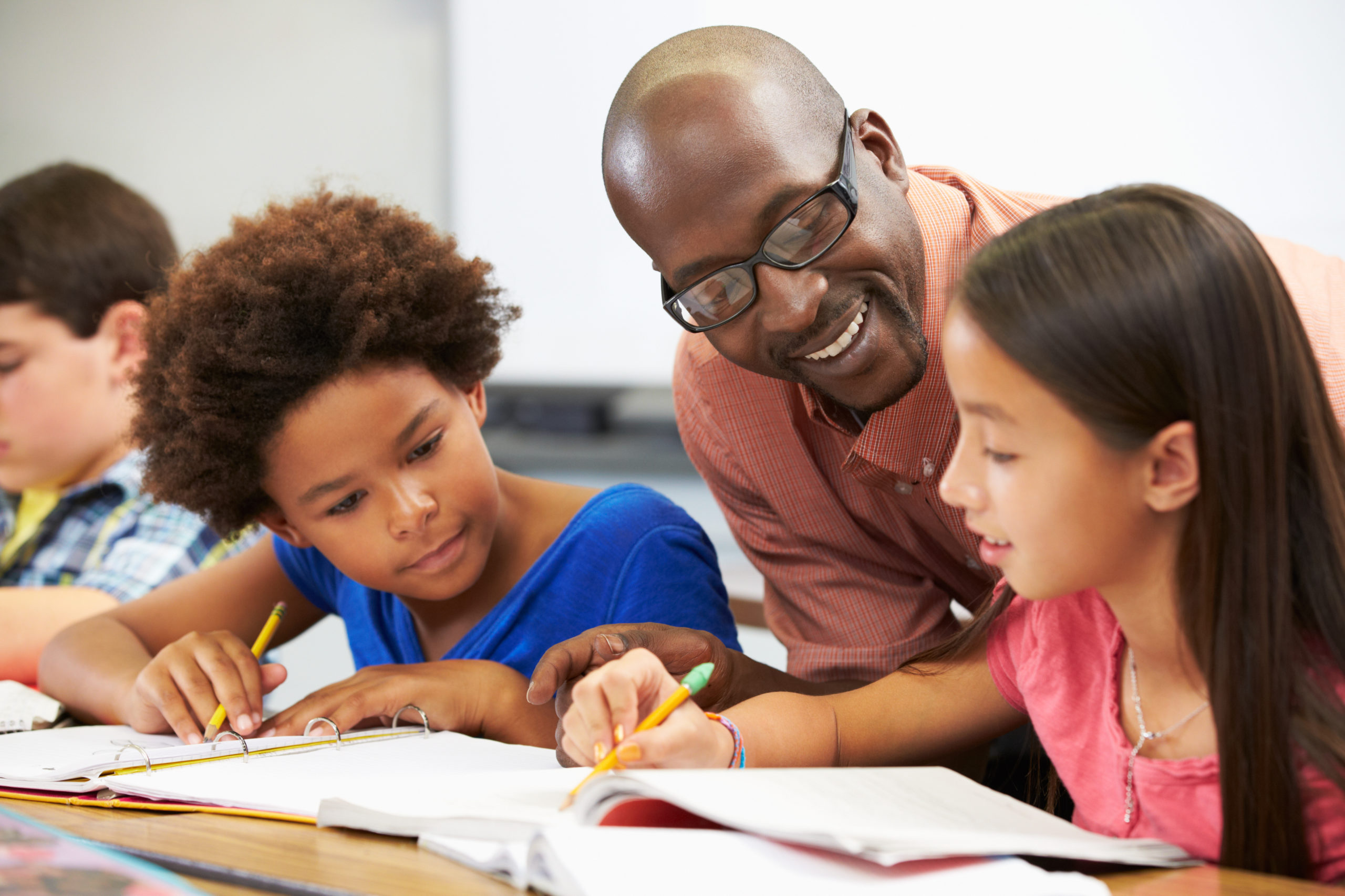 teacher guiding students in classroom