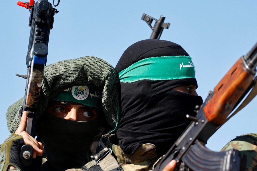 A photo depicting Hamas fighters in a military formation, emphasizing their organized and equipped nature.