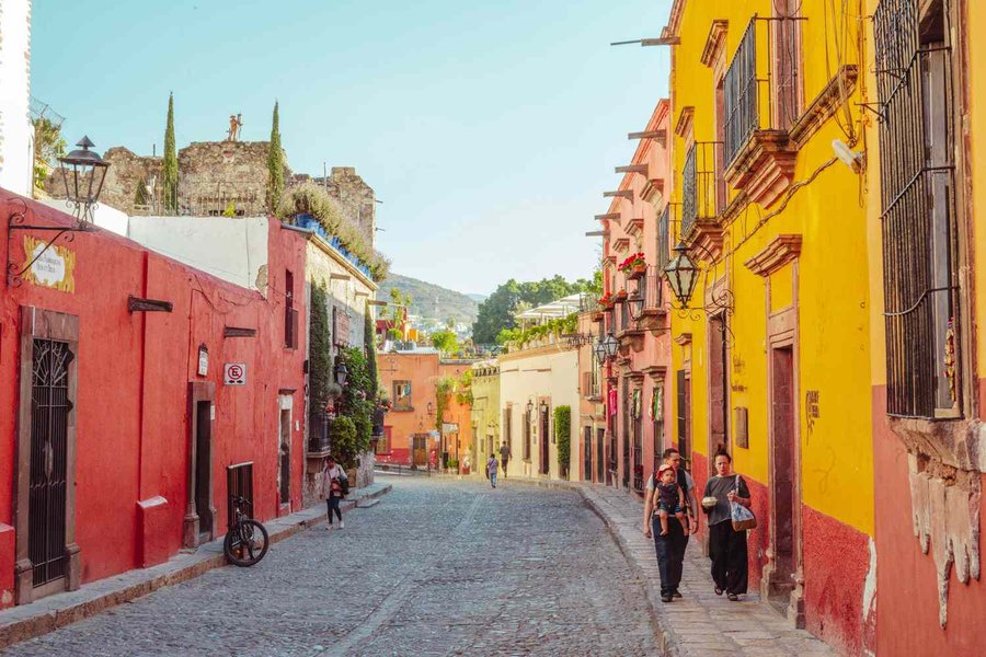 Cobblestone street in San Miguel de Allende with shaded areas